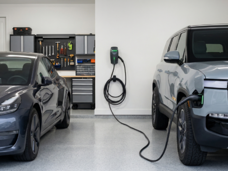 A shared home EV charging station setup for a dual-vehicle household featuring both NACS and J1772 charging ports.